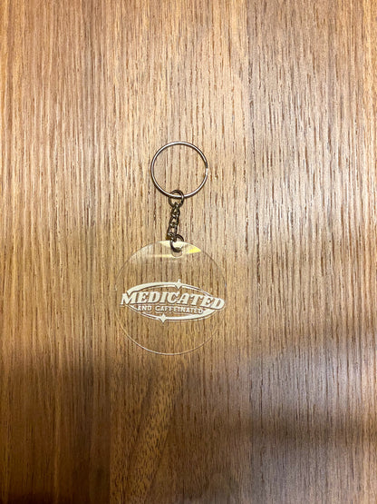 medicated and caffeinated white clear acrylic keychain